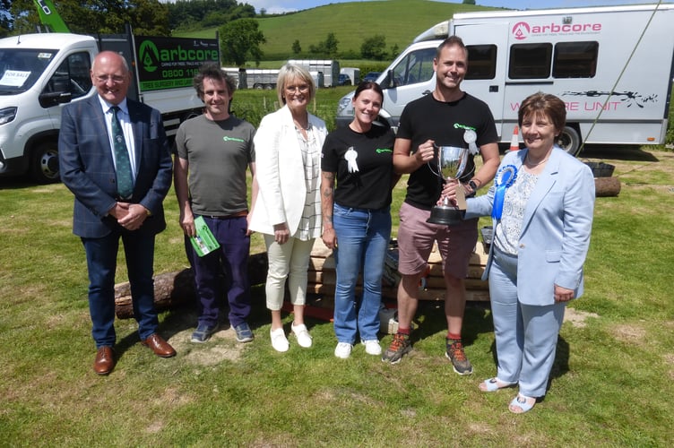 Sheila Rattray, Show president, presents the cup for Best Trade Stand to Arbcore, along with judges, Rowland and Sian Rees-Evans