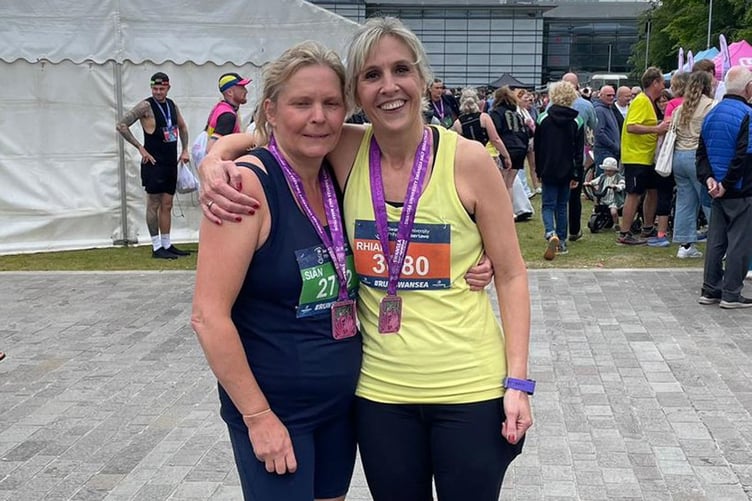 Sian and Rhian after completing their first half marathon at Swansea