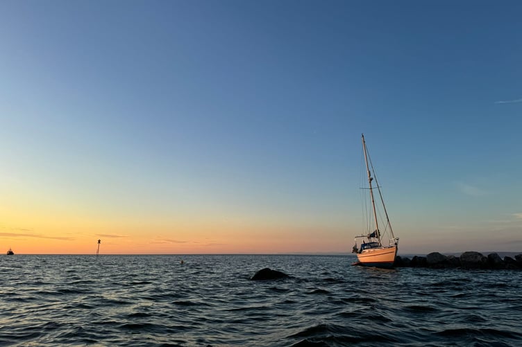 Stricken vessel aground on rocks in Aberaeron harbour
