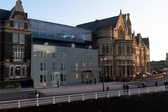 The new building and glass-fronted function room built behind the Georgian villas