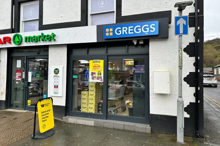 The current defibrillator box outside the Spar in Machynlleth is hard to spot (white, on the wall to the right)