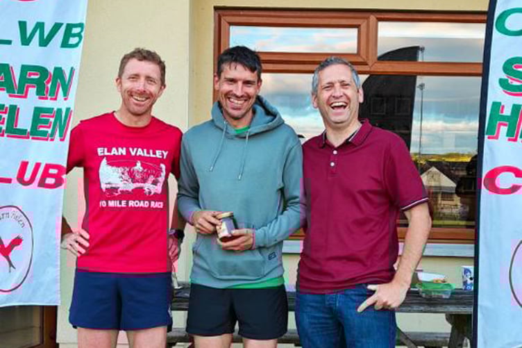 Series winner Dylan Lewis with Rhys Burton, race director and Owain Schiavone, series director