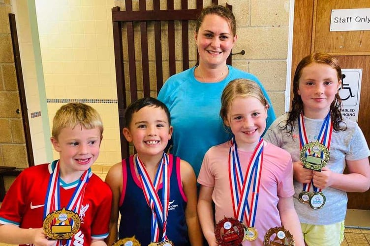 Some of the young swimmers with their medals