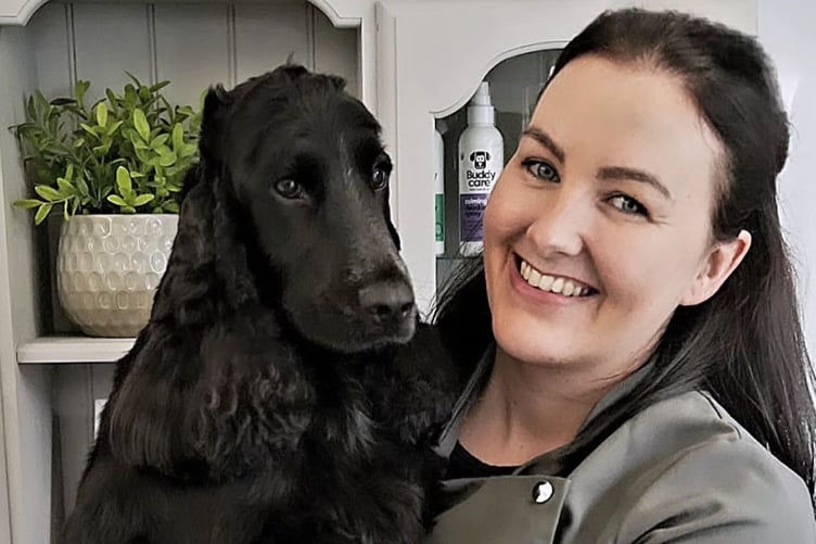 Lisa Morgan dog groomer and her business mascot and beloved spaniel Olly