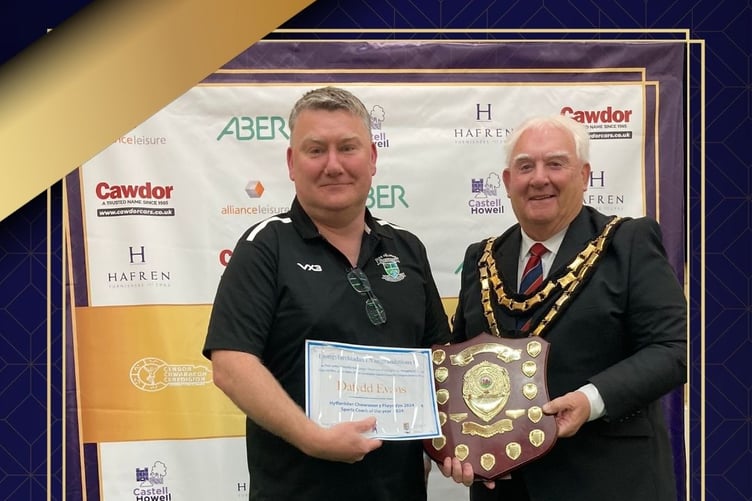 Dafydd Evans receiving the Trainer of the Year award from Cllr Keith Evans, Chairman of Ceredigion County Council