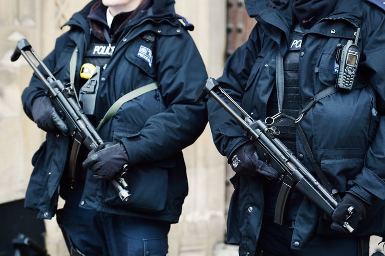 Metropolitan Police firearms officers stand outside the Houses of Parliament in London, as the number of armed officers in Britain's biggest police force will rise by more than a quarter after the Paris terror attacks.