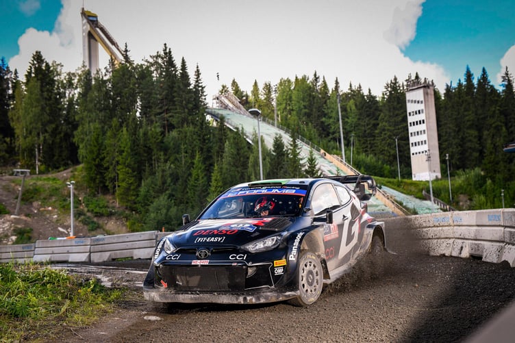 Elfyn Evans maneuvers around a corner at Rally Finland