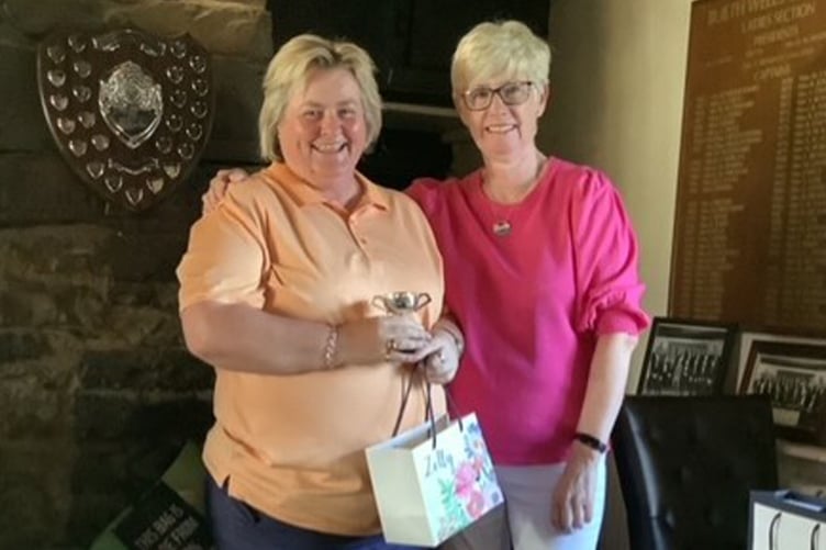 Clare Jones being presented with the Captains Outing Cup from Captain Catrin Pugh Jones