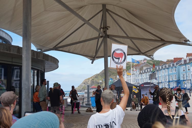 The Samba band playing under the awning of the Aberystwyth bandstand at the anti-racism protest