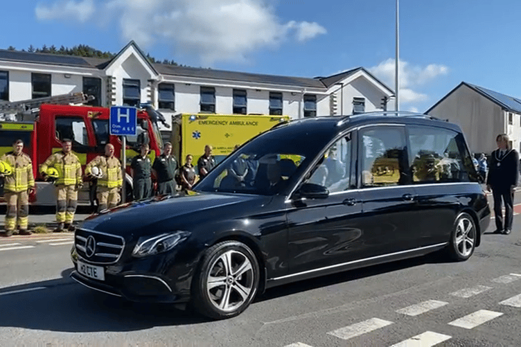 Firemen and ambulance staff came out in uniform to pay their last respects to Cllr Michael Williams