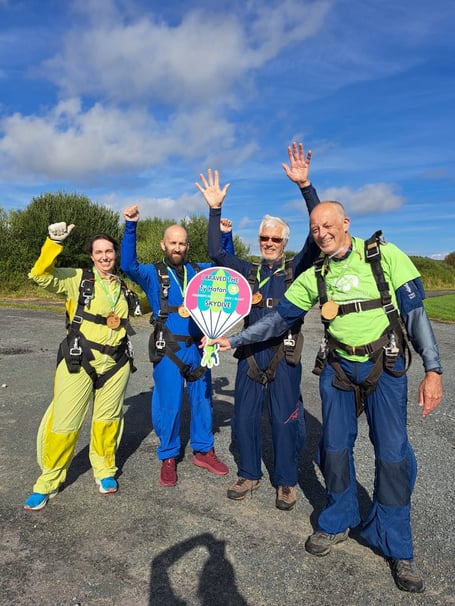 Philip, right, wearing a Ty Hafan t-shirt, his brother, John, next to him, and others who completed the parachute jump that day