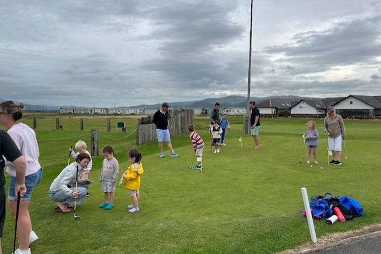 The youngsters demonstrating their golfing skills