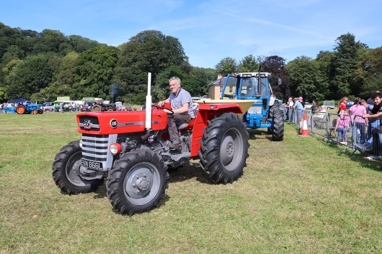 A four wheel drive MF135 in the afternoon parade around the main ring