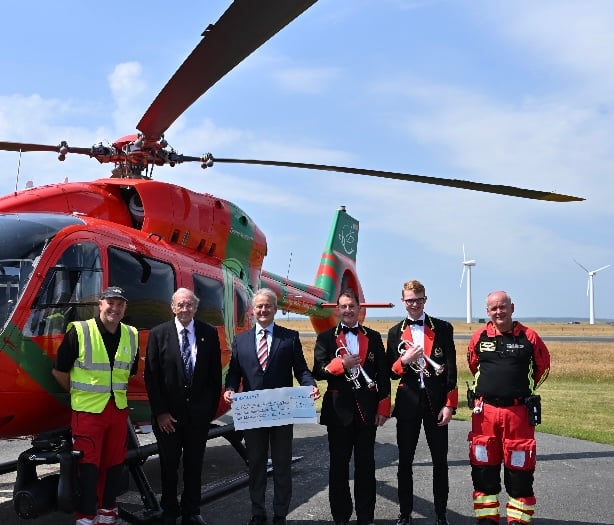 Gwynedd silver band present £2,500 to air ambulance charity