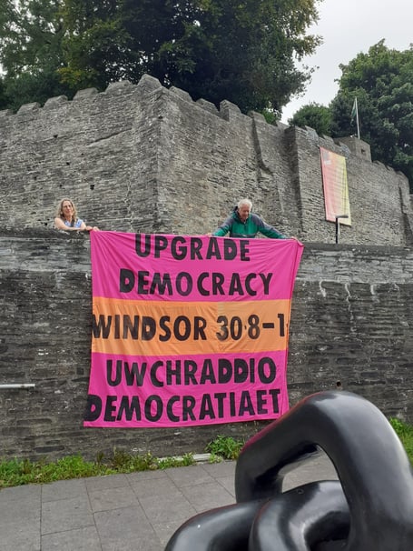 The group's banner at Cardigan Castle