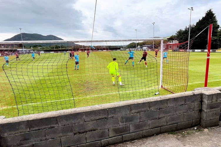 Tom Hilditch heads in Porthmadog's fourth goal against NFA shortly before half time