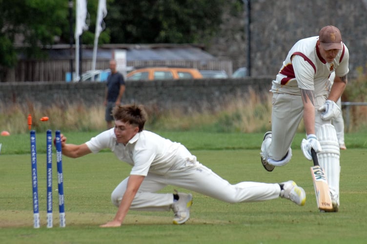 Morgan Yorke completing a run out before scoring 55 not out later