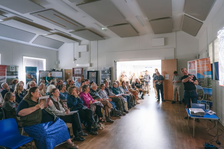 The packed hall at the Community Hub in Penparcau enjoying a talk on the Pendinas hillfort. Photo: Crown Copyright: RCAHMW