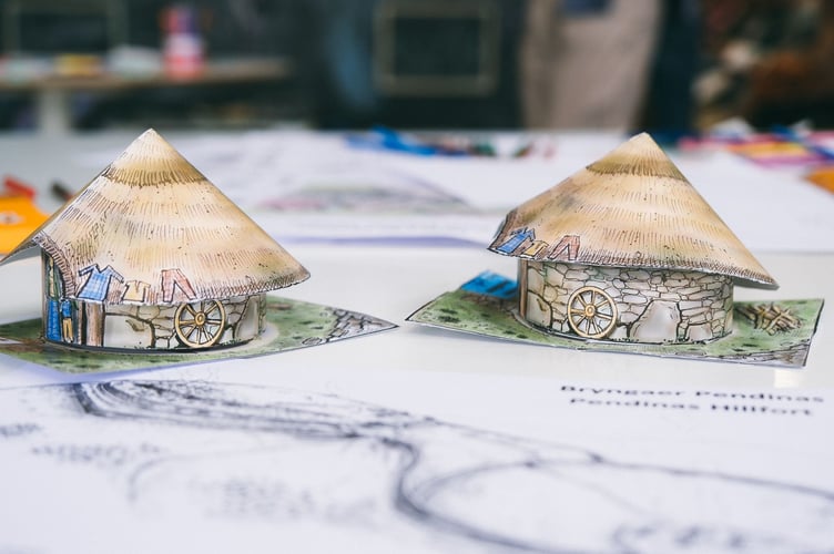 Models of Celtic roundhouses made at the festival. Photo: Crown Copyright: RCAHMW