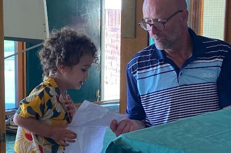 The captain was helped by his grandson during the award presentations