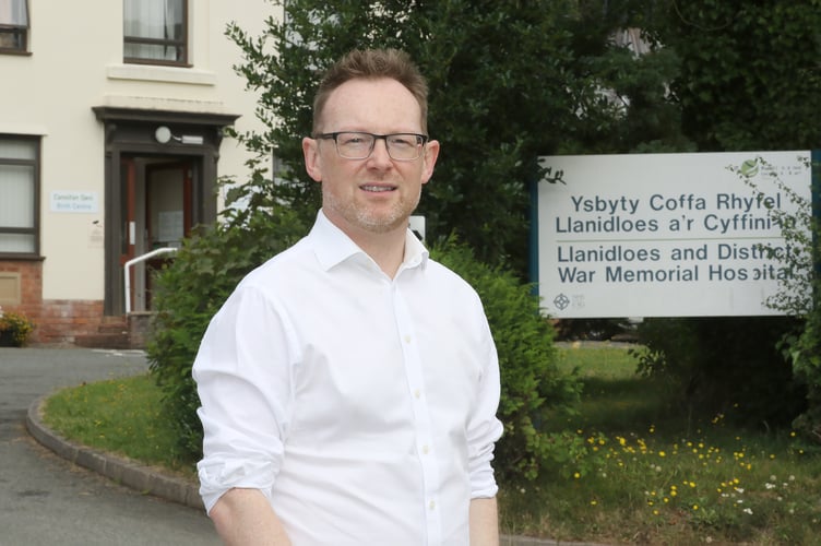 MS Russell George outside Llanidloes Hospital