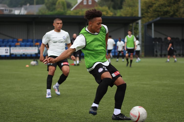 Bala defender Uniss Kargbo warms up before the Cardiff met game