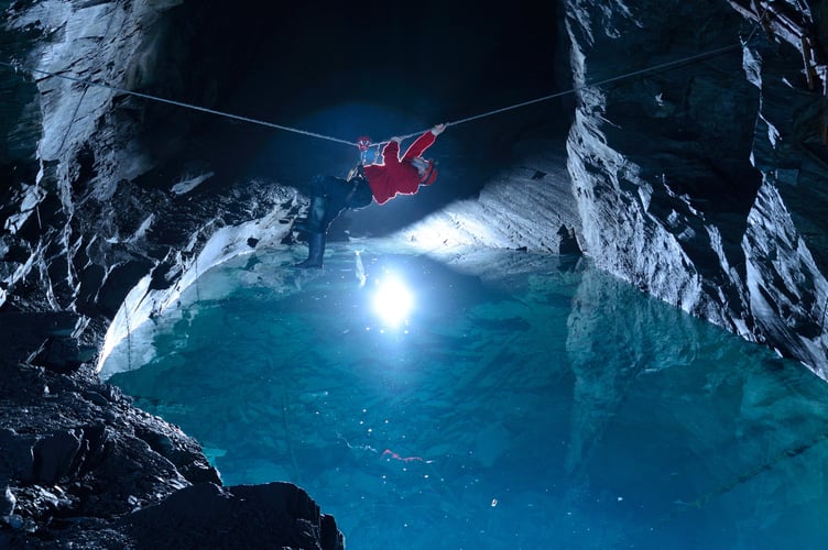 Visitors at Go Below must traverse an underground route through a series of mines and caverns before reaching Deep Sleep 1,375ft below Snowdonia. Release date September 11 2024. A unique underground hotel experience 1,375ft below Snowdonia's depths promises 'the deepest sleep in the world'. The adventure, promised to be an 'experience like no other on Earth', sees people venture down through an abandoned Victorian slate mine to reach a remote off-grid camp of Deep Sleep. Set a staggering 1,375 vertical feet below the mountains of Snowdonia and with an all-year-round temperature 10 degrees Celsius, the camp comprises of four private twin-bed cabins and a 'romantic grotto' with a double bed.