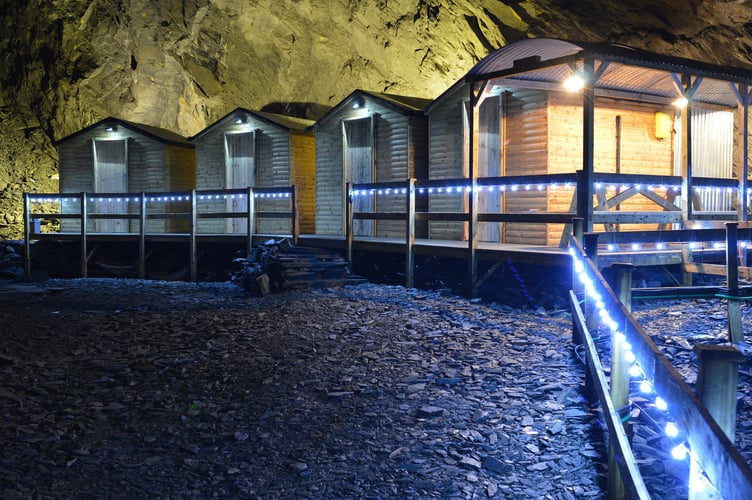 Twin-bed cabins 1,375ft below Snowdonia at Go Below Deep Sleep. Release date September 11 2024. A unique underground hotel experience 1,375ft below Snowdonia's depths promises 'the deepest sleep in the world'. The adventure, promised to be an 'experience like no other on Earth', sees people venture down through an abandoned Victorian slate mine to reach a remote off-grid camp of Deep Sleep. Set a staggering 1,375 vertical feet below the mountains of Snowdonia and with an all-year-round temperature 10 degrees Celsius, the camp comprises of four private twin-bed cabins and a 'romantic grotto' with a double bed.