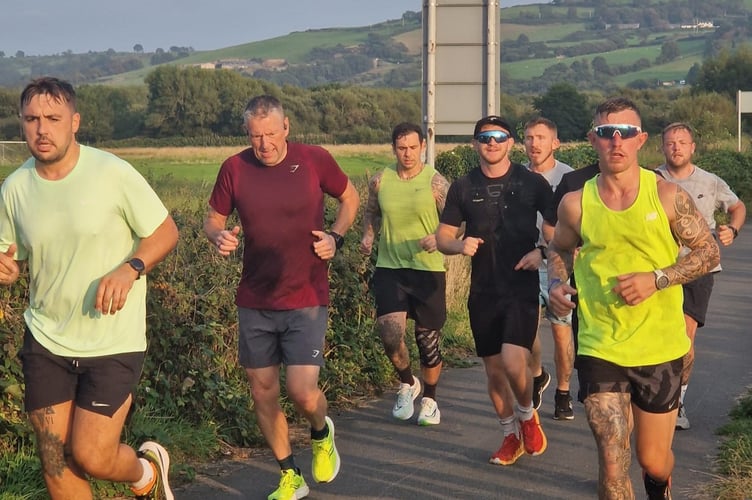 Andrew (in yellow) running laps with some of his supporters