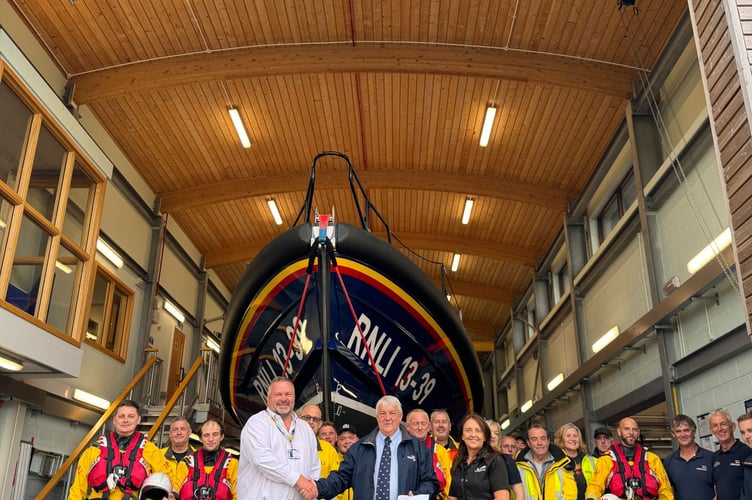 Haven Porthmadog donate money from a charity football match to Pwllheli RNLI. Photo: RNLI/Caroline Jones