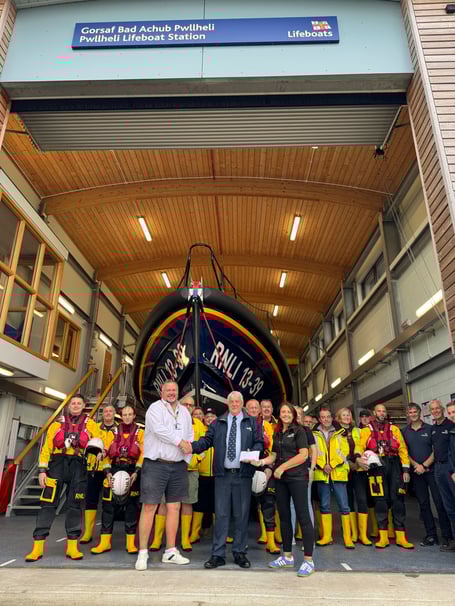 Haven Porthmadog donate money from a charity football match to Pwllheli RNLI. Photo: RNLI/Caroline Jones