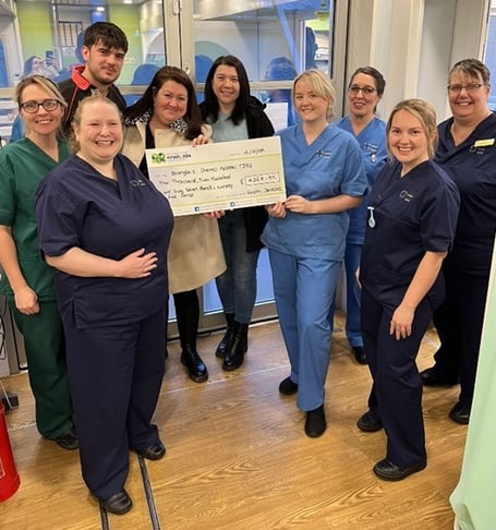 Owain Jenkins, Lisa Hurcombe and Hayley Jenkins with staff from the Chemotherapy Day Unit