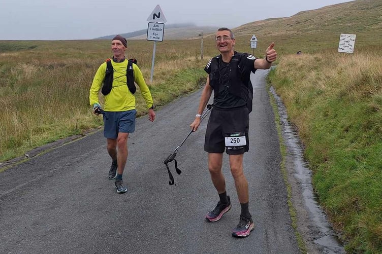 Dave and Balaz, incredibly still smiling during the gruelling Dragon's Back Race