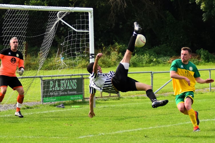A spectacular overhead kick during Bow Street's 7-0 defeat of Llanidloes (Photo: Bev Hemmings)