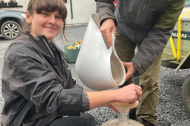 A happy customer at a Gelli Deg Dyfi apple juicing event