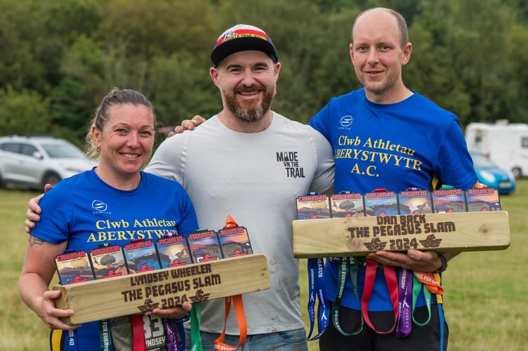 Lyndsey and Dan celebrating their achievements with Pegasus Slam challenge organiser Rhys Jenkins 
