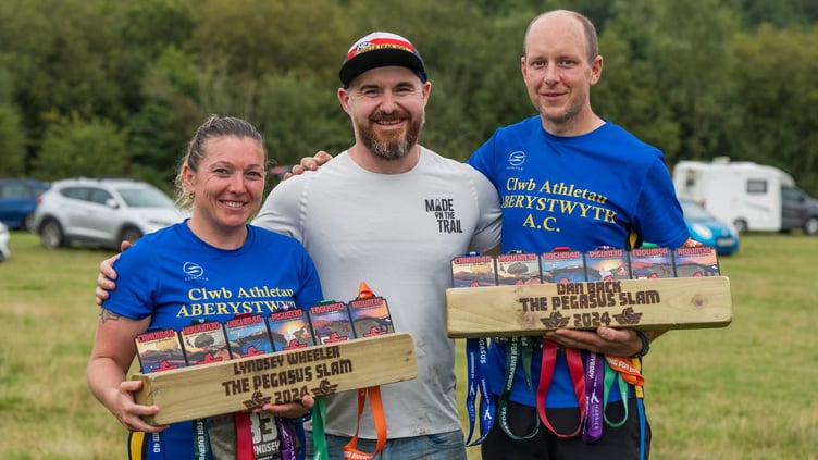 Lyndsey and Dan celebrating their achievements with Pegasus Slam challenge organiser Rhys Jenkins