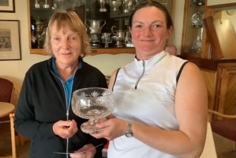 Chris and Sherrie with the MWCGA greensome competition trophy