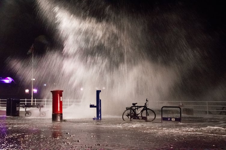 A wave crashing down onto the promenade in Aberystwyth on Sunday night