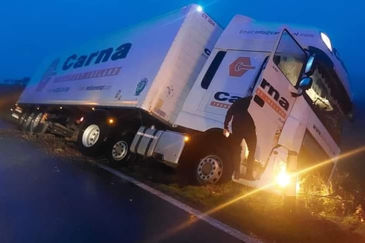 The Carna lorry hanging off the side of a verge on the A487 this morning