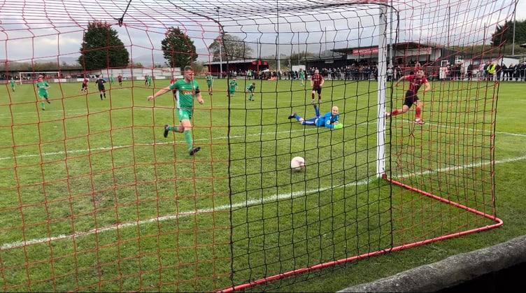 Danny Brookwell scores the winner for Porthmadog against Rhyl 1879 on Saturday.