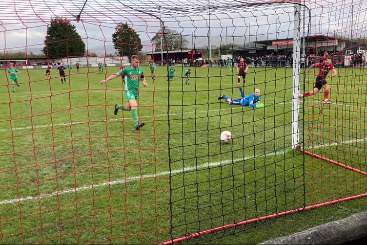 Danny Brookwell scores the winner for Porthmadog against Rhyl 1879 on Saturday.