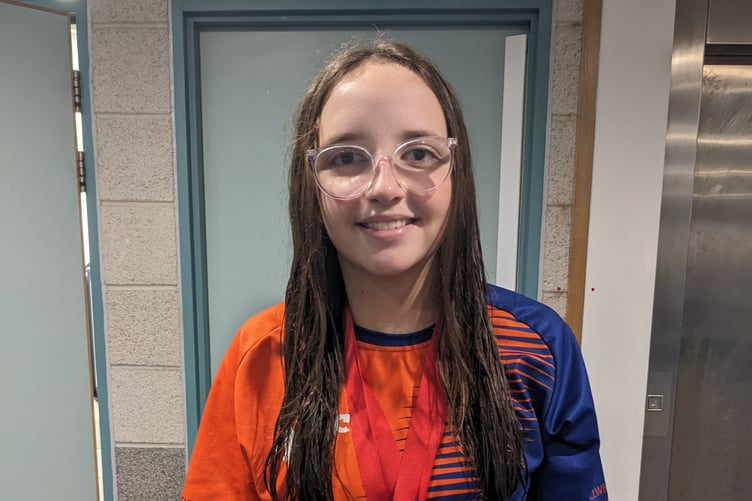 Caitlin Middleton with her bronze medals in the 50m and 100m backstroke