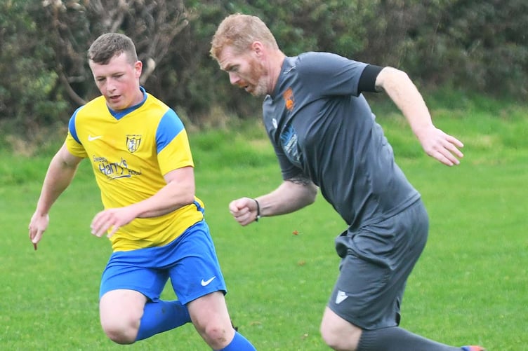 Tim Holt bursts forward for Tywyn (Photo: Doris O'Keefe)