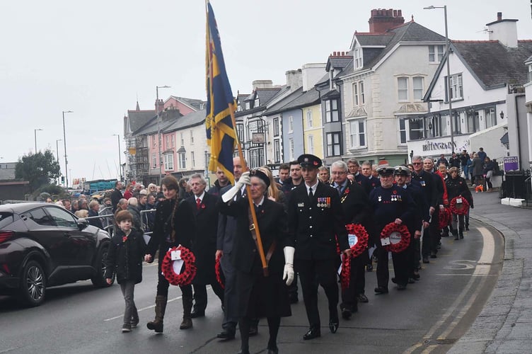 Aberdyfi's Remembrance Service March to the War Memorial at St Peter's Church. Photo: Doris O’Keefe