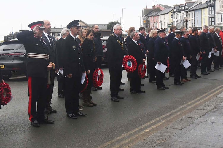 Lord Lieutenant of Gwynedd Edmund Seymour Bailey salutes the War Memorial at St Peter's Church. Photo: Doris O’Keefe