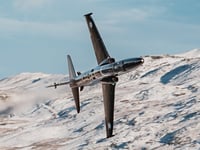 Jaw-dropping pictures show airplanes zooming through a snowy Mach Loop