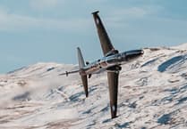 Jaw-dropping pictures show RAF airplanes zooming through a snowy Mach Loop
