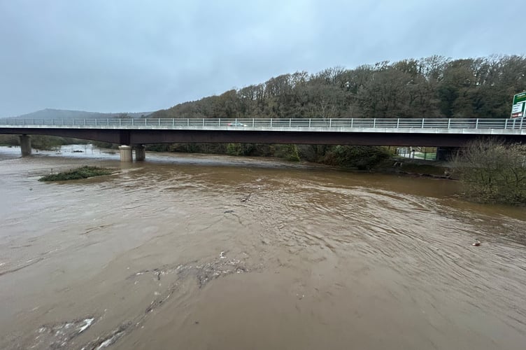 The river Dyfi bursts its banks over the weekend near Machynlleth as the new Dyfi road bridge is put to the test