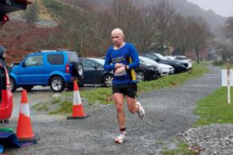 Gary Wyn Davies crossing the finish line